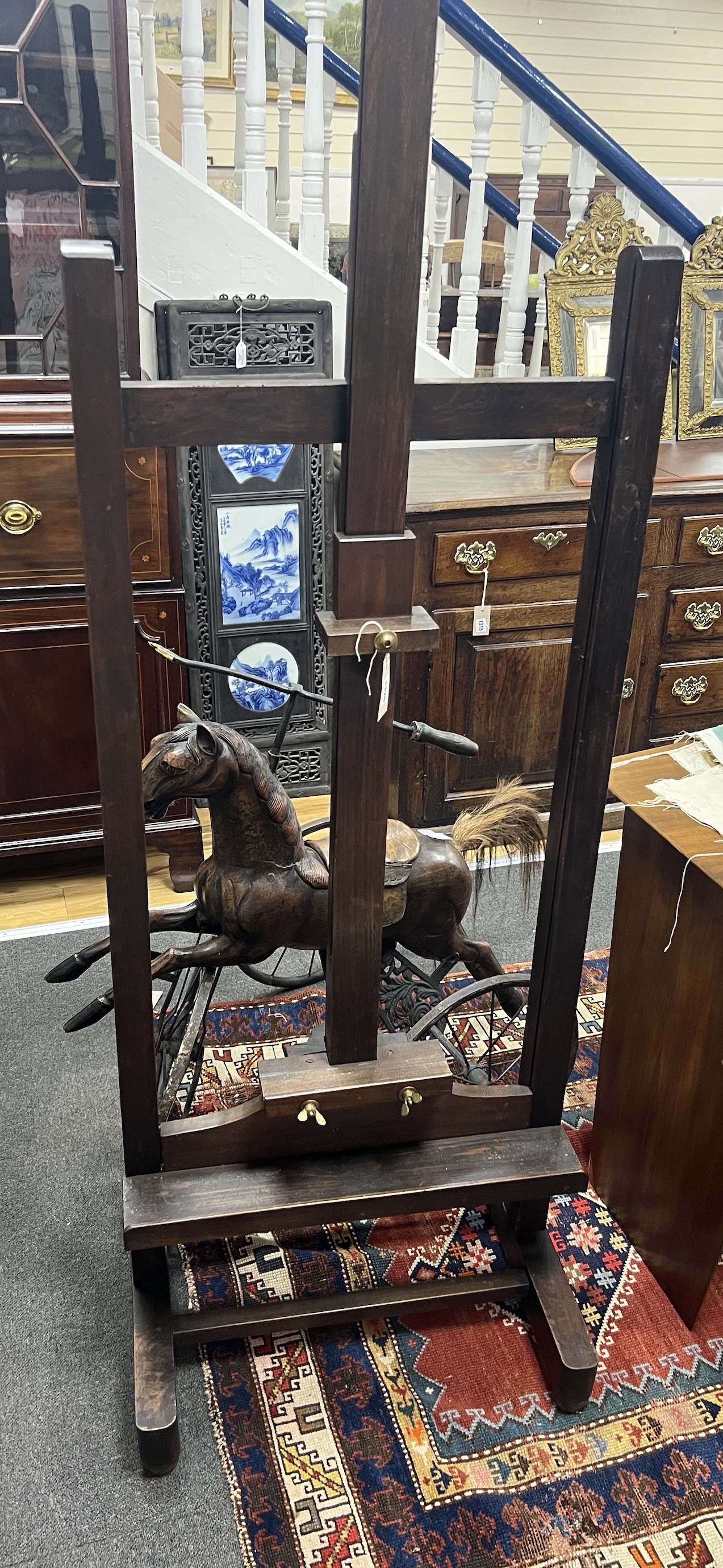 A late Victorian pine and beech artist's studio easel, width 62cm, height 180cm